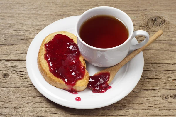 Tea cup and bread with jam — Stock Photo, Image