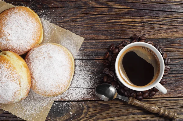 Sweet donuts and coffee cup on table Stock Snímky