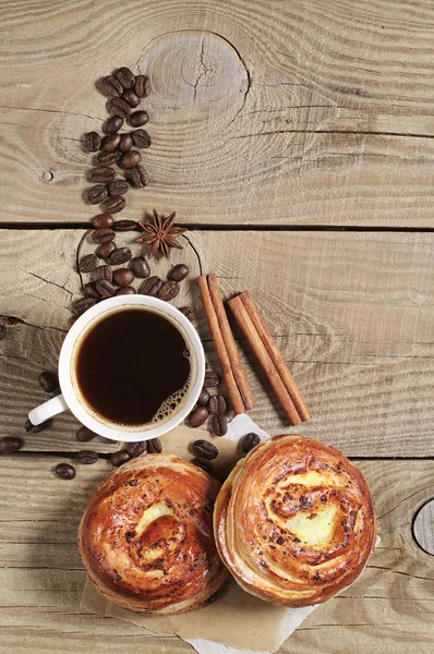 Sweet buns and cup of coffee — Stock Photo, Image