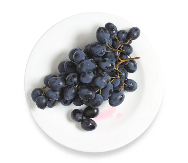 Dark grapes in plate — Stock Photo, Image