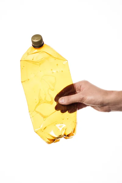 Ruka držící plastové láhve — Stock fotografie