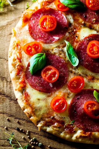 Fresh pizza on wood — Stock Photo, Image