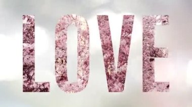 Aşk sözcüğü, çiçekli bir animasyon ve arka planda kayan parlak ışıklarla geniş bir görünüm sergiledi. Kutlama kartı, canlandırmalı tebrik kartı..