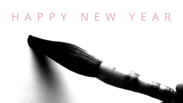 Happy New Year 2016 in english - writing calligraphy with a brush and thick ink with reflections - greeting video card with wishes appearing on the top. — Stock Video