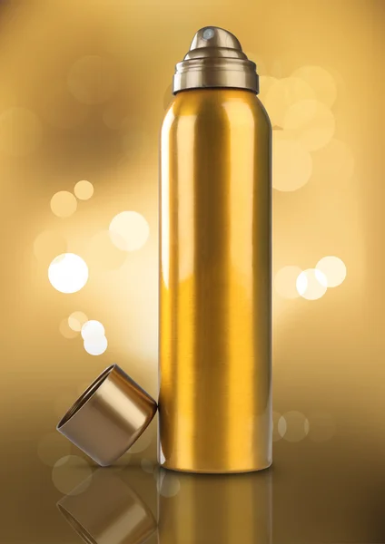 Perfume de desodorizante de ouro pode ou Bottle Bokeh fundo — Fotografia de Stock