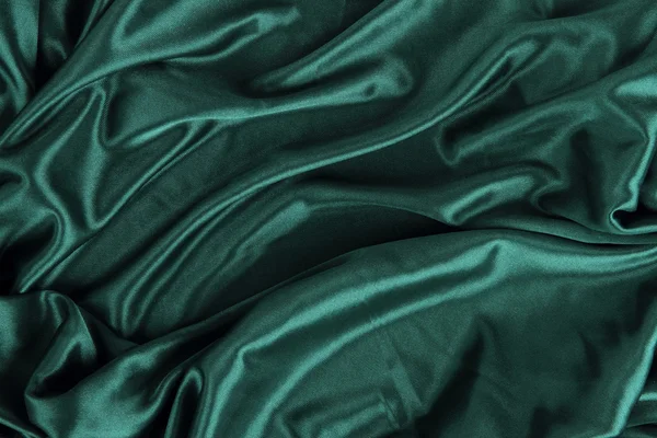 Ткань темно-зеленой атласной шелковой ткани — стоковое фото