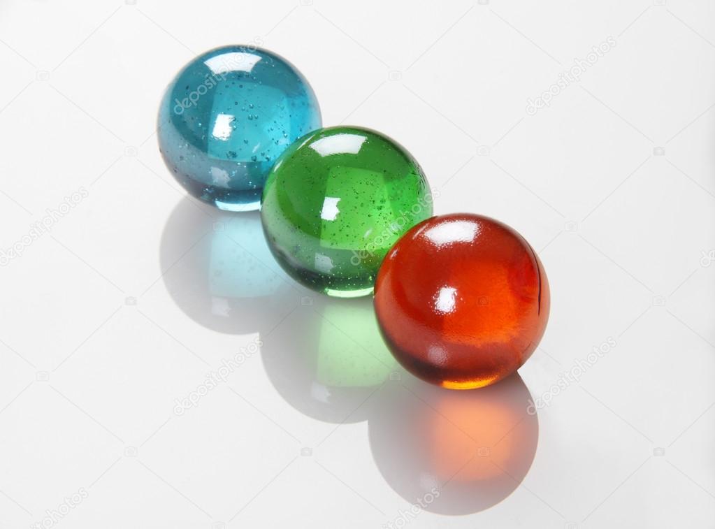 RGB Color Balls / Marbles /Orbs on white Reflective Background