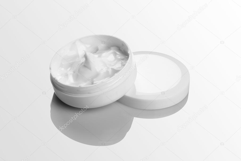 Cosmetic Cream Pack Mockup on white reflective background