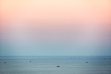 Small fishing boats in South China Sea at dusk, Mui Ne, Vietnam clipart