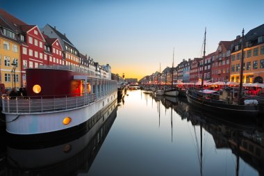 Ships in Nyhavn at sunset, Copenhagen, Denmark clipart