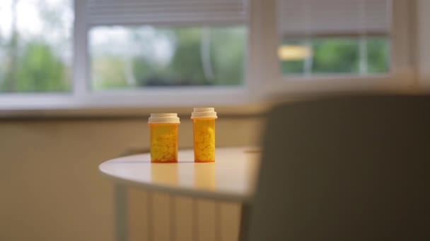 Man takes a bottle of pills on the table — Stock Video