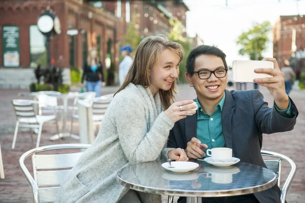 Young people taking a selfie in cafe — Stock Photo, Image