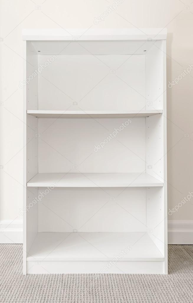 Empty white bookshelf