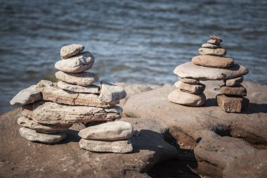 Two stacked stone cairns clipart