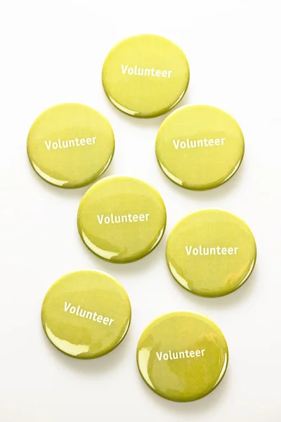 Many volunteer buttons — Stock Photo, Image