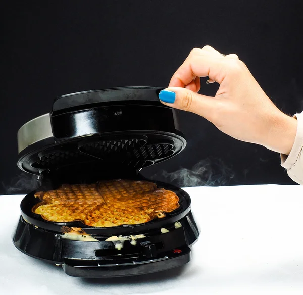 Person making fresh waffles — Stock Photo, Image