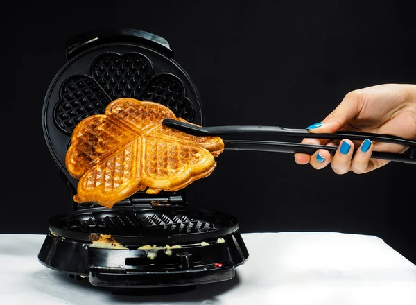 Person making fresh waffles — Stock Photo, Image