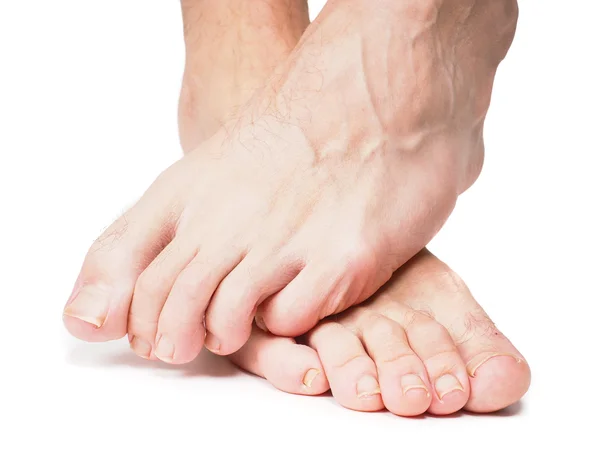 Piedi maschili uno sopra l'altro — Foto Stock