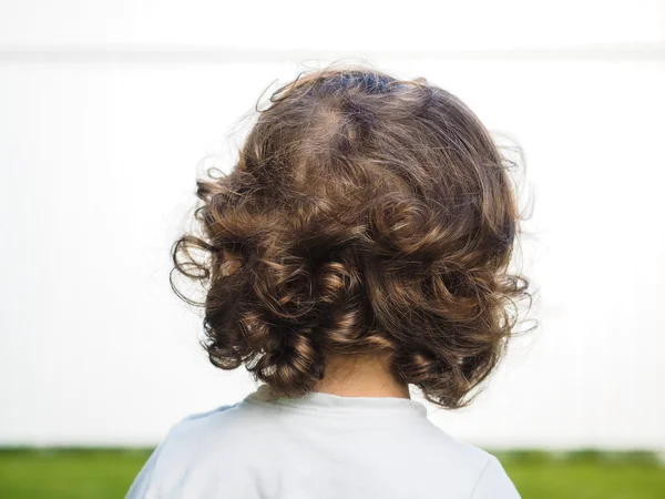 Little caucasian person with curly hair Royalty Free Stock Images