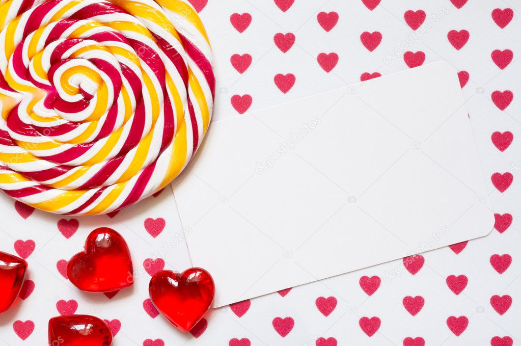 Lollipop on a background with hearts and a list of paper for your text.