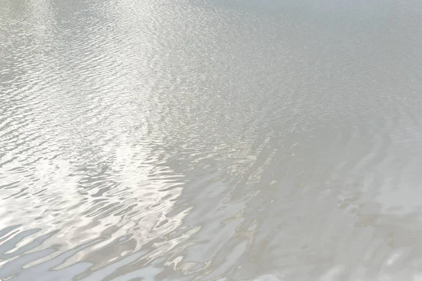 stock image Reflection of light on a water surface in neutral gray tones