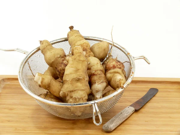 Jerusalem artichokes in the sieve — Stock Photo, Image