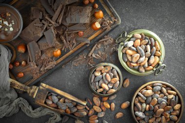 Cocoa beans on old background
