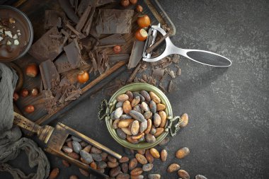 Cocoa beans on old background