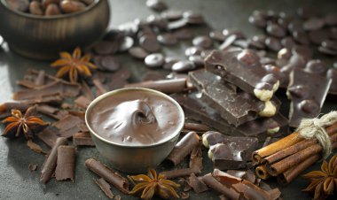 Cocoa beans on old background