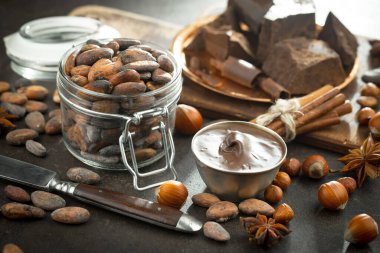 Cocoa beans on old background