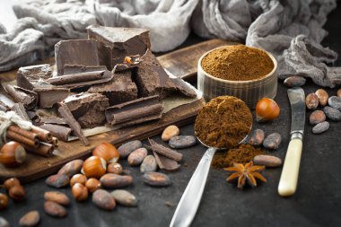 Cocoa beans on old background