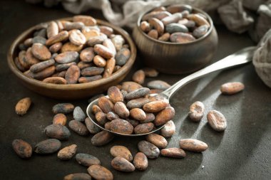 Cocoa beans on old background