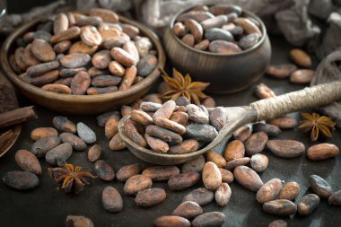 Cocoa beans on old background