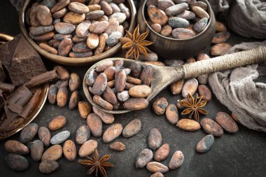 Cocoa beans on old background