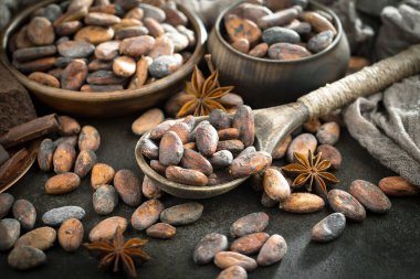 Cocoa beans on old background