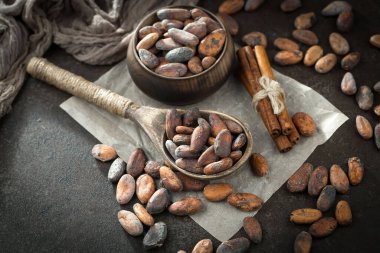 Cocoa beans on old background