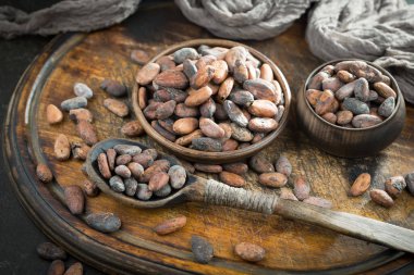 Cocoa beans on old background