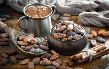 Cocoa beans on old background