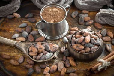 Cocoa beans on old background