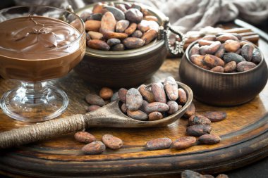 Cocoa beans on old background