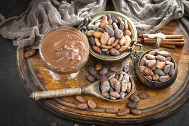 Cocoa beans on old background