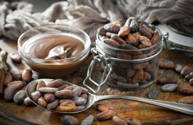 Cocoa beans on old background