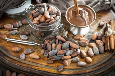 Cocoa beans on old background