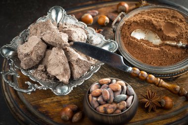 Cocoa beans on old background