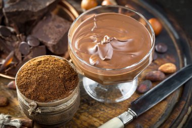 Cocoa beans on old background