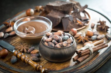 Cocoa beans on old background