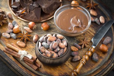 Cocoa beans on old background