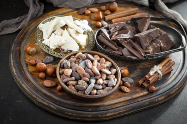 Cocoa beans on old background