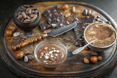 Cocoa beans on old background