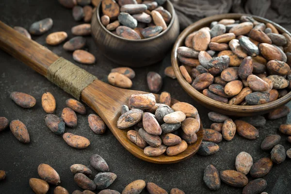Cocoa beans on old background
